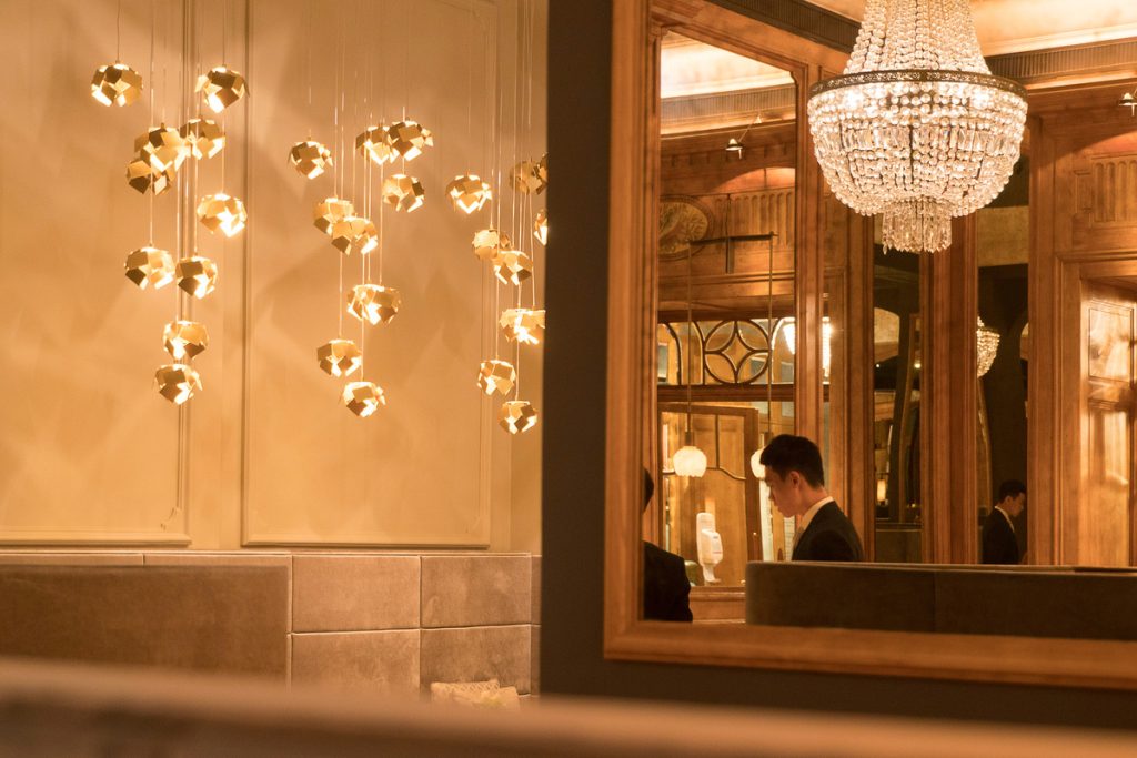 Young waiter working in a luxury hotel